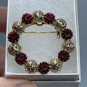 Vintage gold colored filigree globes red faceted AB coated glass brooch